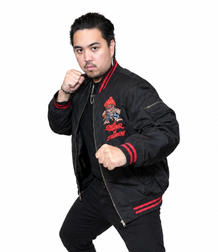 Gio Contreras Street Fighter Event 2026 Black Bomber Jacket Gio Contreras wearing a black Street Fighter bomber jacket with red trim and embroidered details
