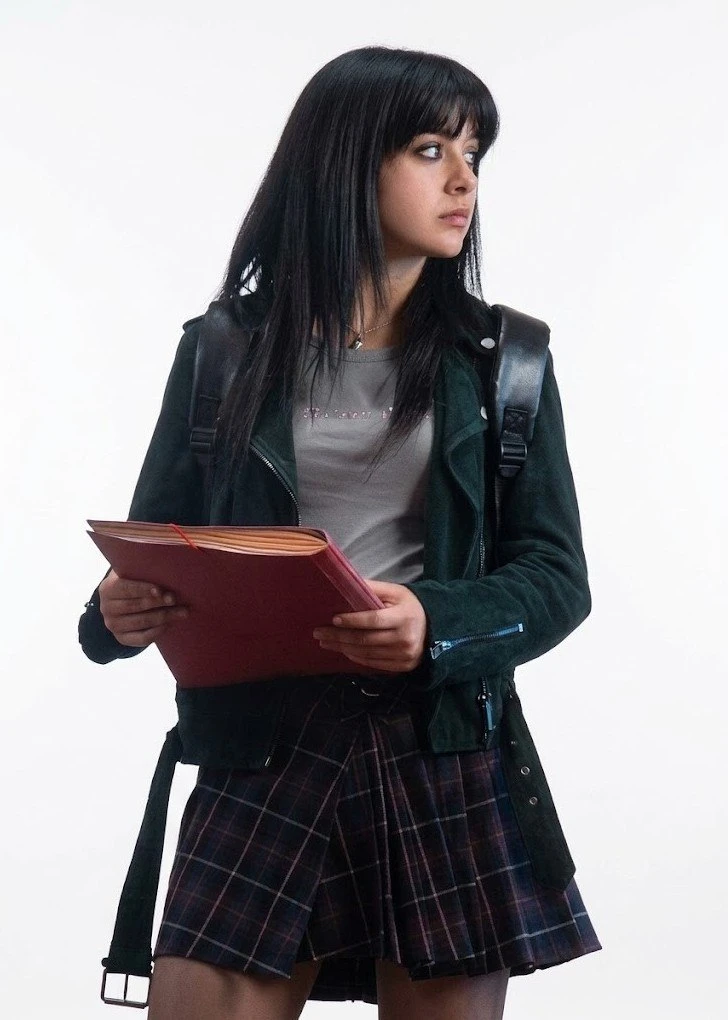 Irene Balmes Dark Green Suede Leather Jacket – Perfect Liars (2026) Irene Balmes-inspired dark green suede leather biker jacket from Perfect Liars (2026), shown with an asymmetrical front zipper and zippered cuffs.