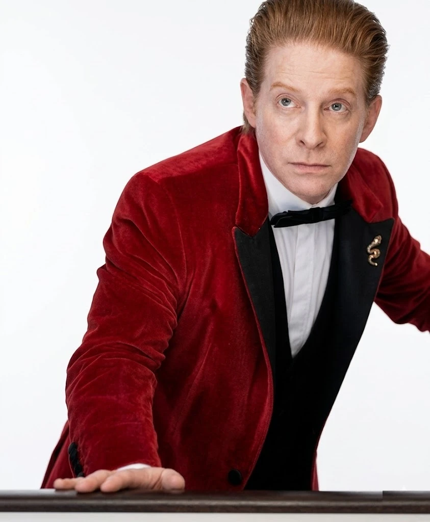 Seth Green wearing red velvet blazer in The Highest Stakes movie