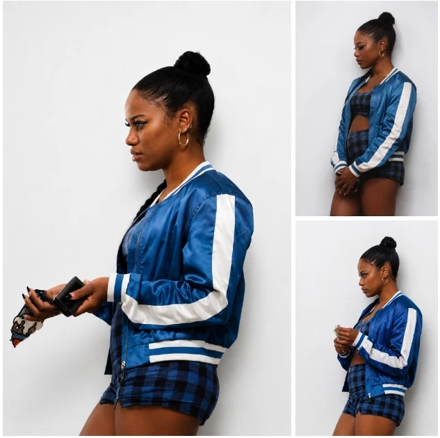 Taylour Paige wearing blue satin bomber jacket in Zola movie